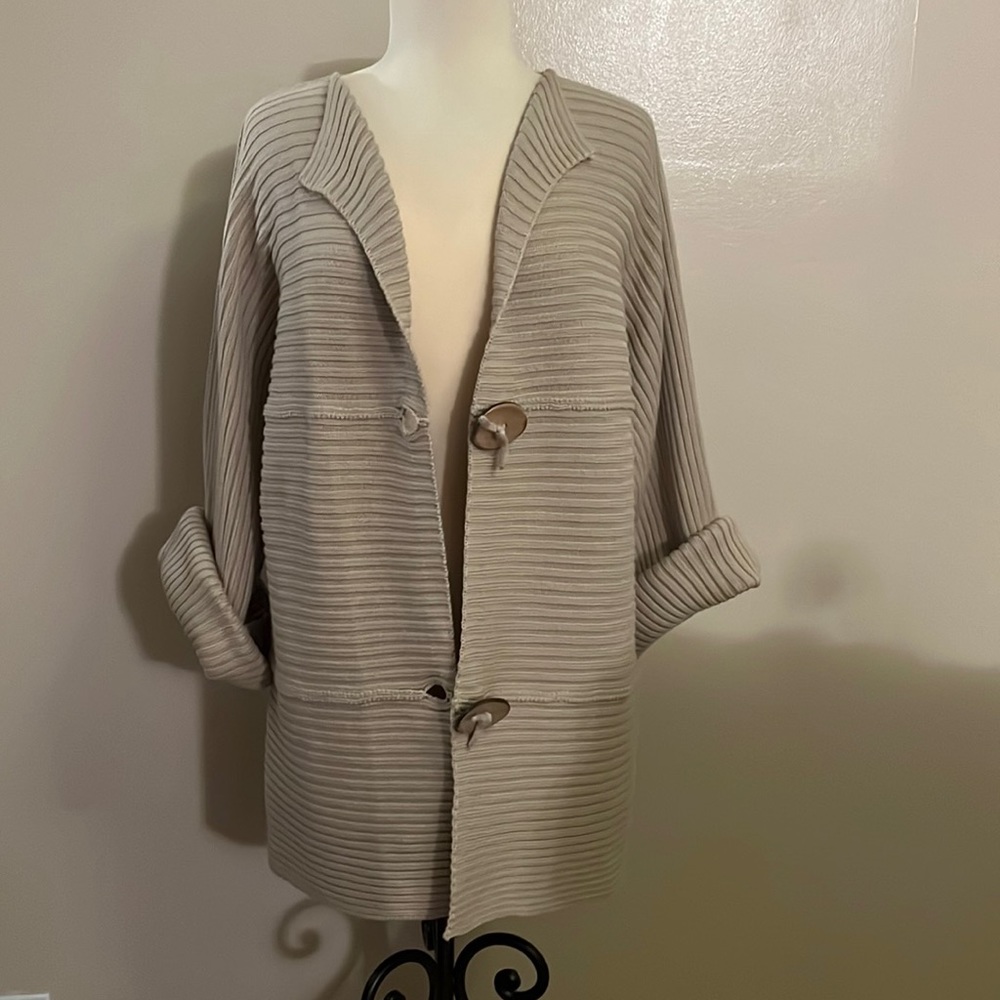 Knit cardigan with oversized coconut shell buttons